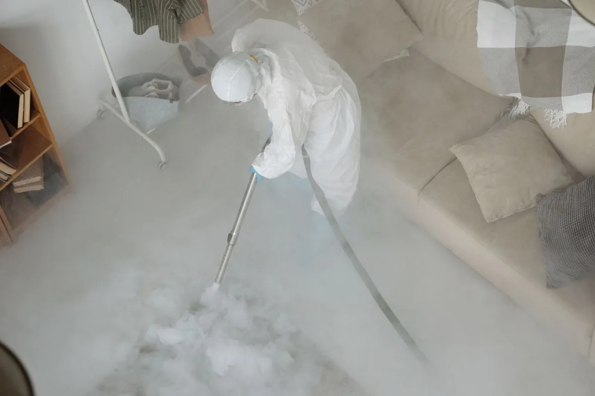 Biohazard cleanup technician in protective equipment, Perry, NY